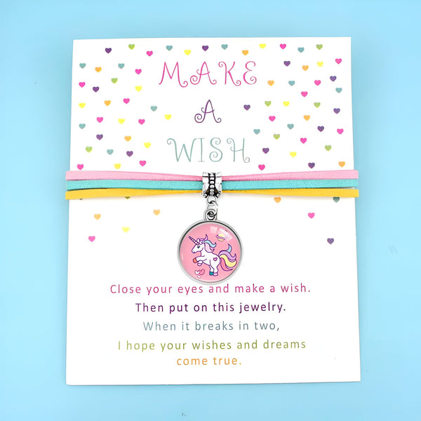 Bracelet "Fais un Voeu" avec pendentif licorne rose et trois cordons colorés (rose, turquoise, jaune). Carte décorée de confettis en forme de cœurs avec message inspirant. Bijou fantaisie pour enfant., 45501401006335 | Licorne Shop