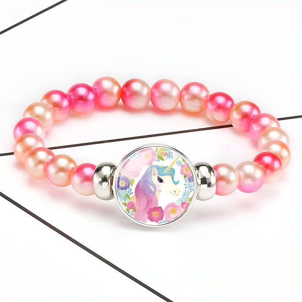 Bracelet enfant avec perles roses et pendentif licorne colorée entourée de fleurs. Accessoire de mode fantaisie pour filles., 45501422829823 | Licorne Shop