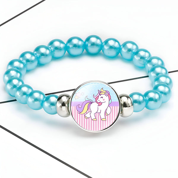 Bracelet enfant bleu turquoise avec un pendentif rond représentant un joli licorne avec une crinière arc-en-ciel. Bijou fantaisie pour fille. Accessoire de mode mignon., 45501398024447 | Licorne Shop