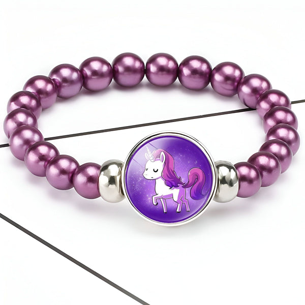 Bracelet de perles violettes avec pendentif rond affichant un dessin de licorne violette. Bijou fantaisie pour enfants., 45501400580351 | Licorne Shop