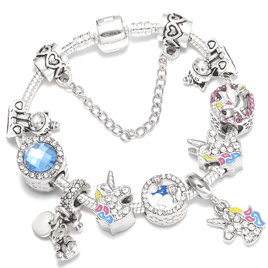 Bracelet de charme argenté avec pendentifs variés : licornes, ours, cœur, pierre bleue. Bijou fantaisie, style Pandora, pour femme ou enfant. Idéal pour un cadeau personnalisé., 45501399531775 | Licorne Shop