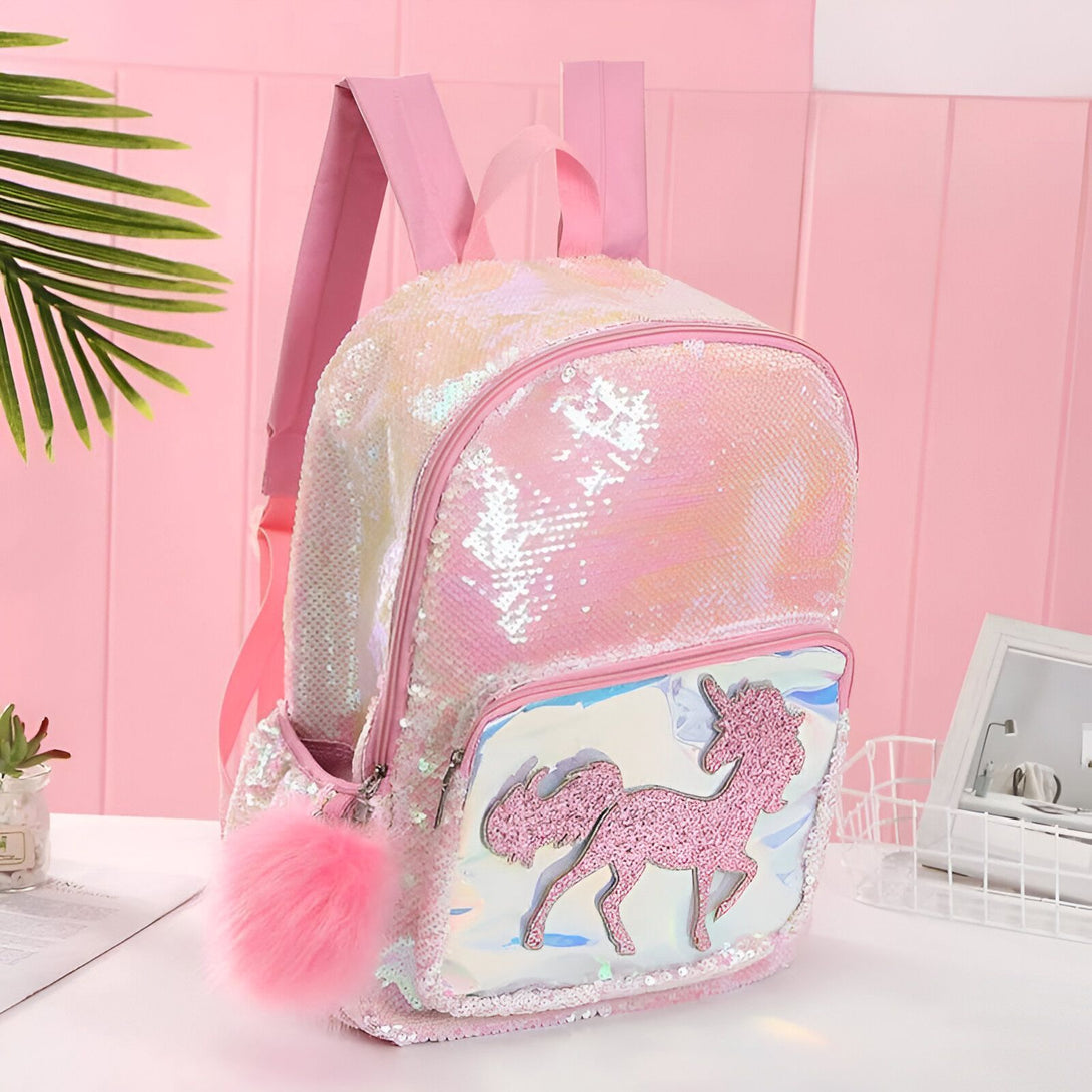 Un sac à dos rose à paillettes avec une image de licorne.