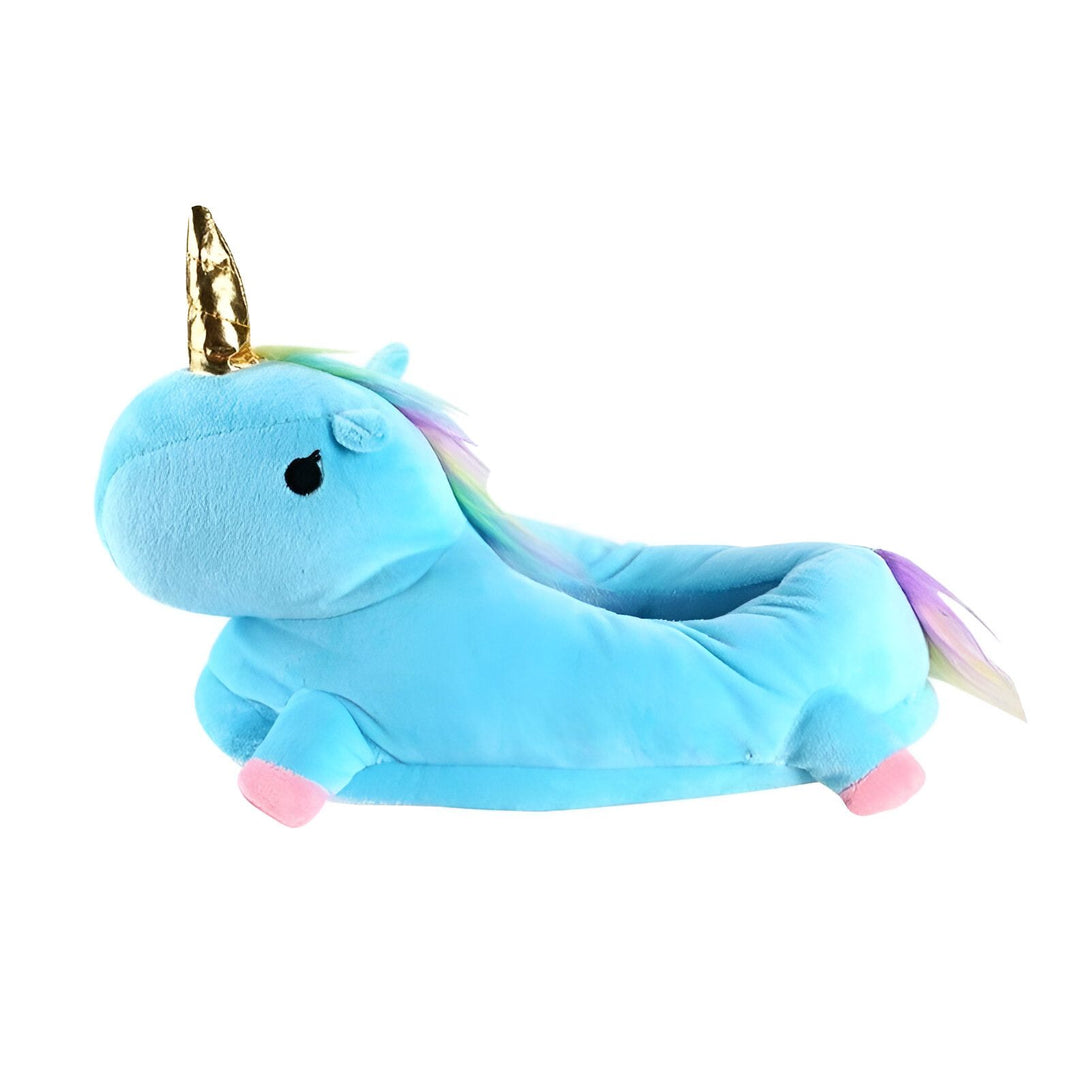 Une peluche licorne bleue avec une corne dorée et une crinière arc-en-ciel.