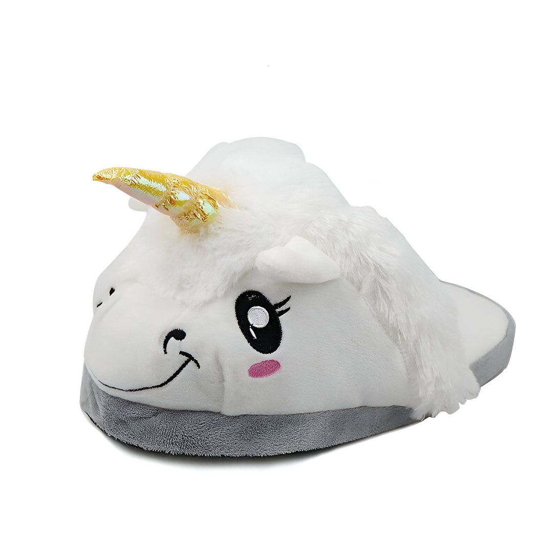 Une peluche licorne blanche et grise avec une corne dorée et des yeux bleus.