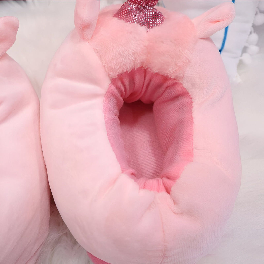 pantoufles licorne rose avec un nœud pailleté sur le dessus