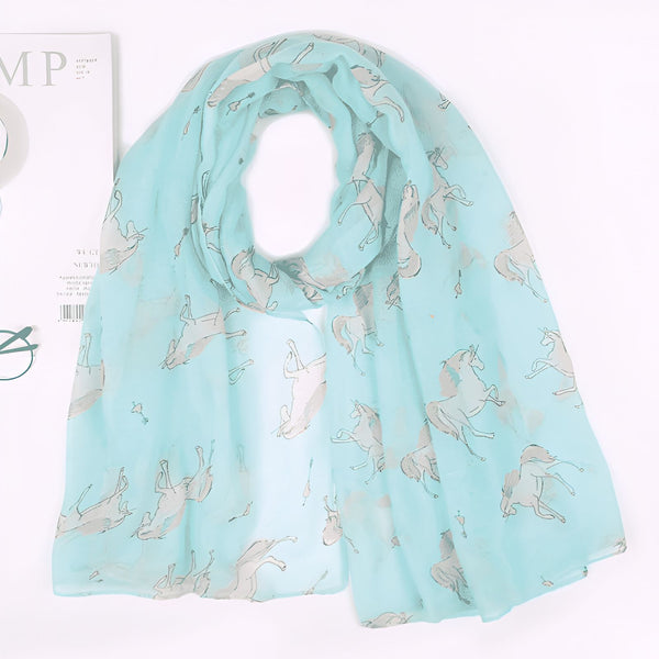 Écharpe turquoise légère avec motif de licornes, accessoire de mode élégant et original. Motif équestre délicat, style unique., 45502079566079 | Licorne Shop