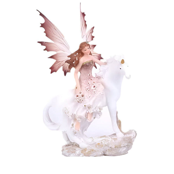 Statuette d'une fée chevauchant une licorne blanche. La fée a des ailes papillon roses et porte une robe florale délicate. La licorne est posée sur un rocher orné. Décoration féerique, fantaisie et magie., 45501363454207 | Licorne Shop