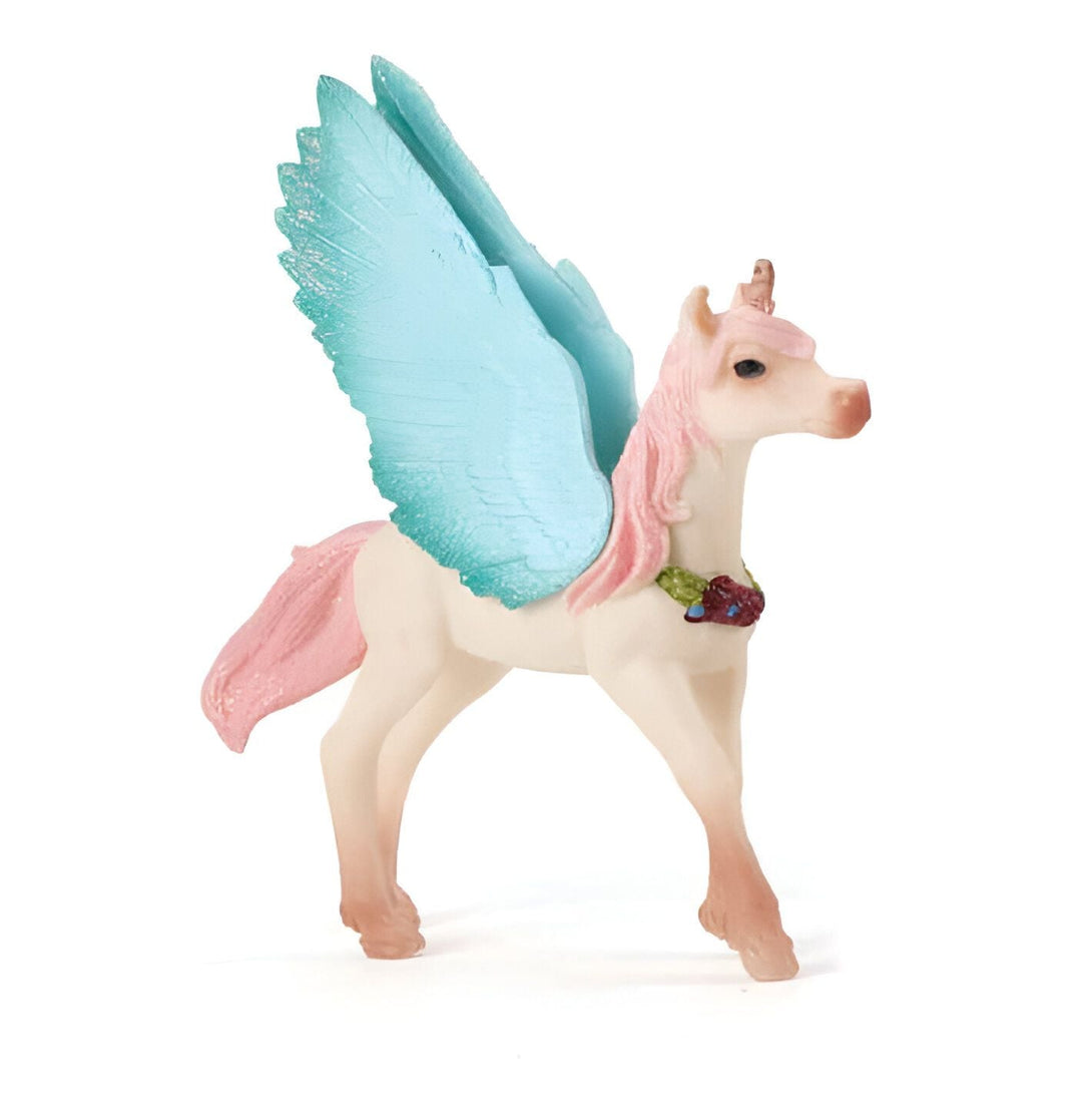 Figurine d'un pégase licorne blanc avec une crinière et une queue roses, et des ailes bleu clair. Il porte une couronne de fleurs autour du cou., 45501363912959 | Licorne Shop