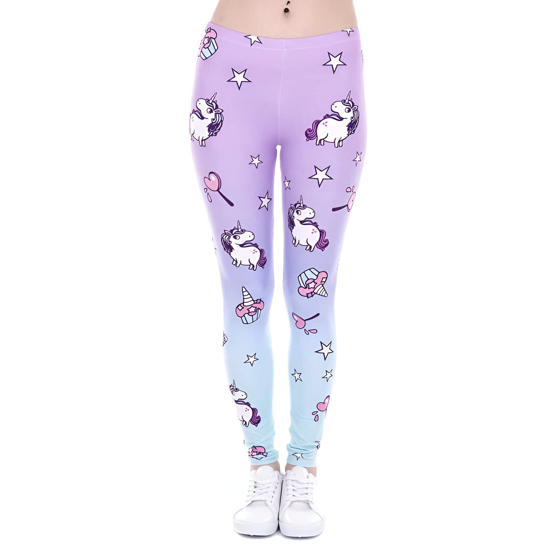Leggings violet et bleu pastel avec motifs d'unicorne, d'étoiles et de confiseries. Une personne porte les leggings et des chaussures blanches. Style fantaisiste et coloré., 45501887217919,45501887447295,45501887578367,45501887709439,45501887840511,45501887971583,45501888102655,45501888233727 | Licorne Shop
