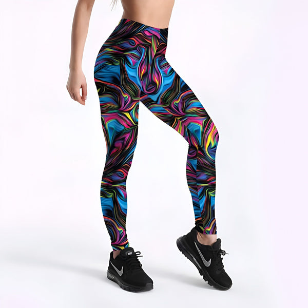 Image d'une femme portant un legging de sport imprimé avec des motifs abstraits colorés en bleu, rose, jaune et noir. Elle porte des baskets noires., 45501934600447,45501934698751,45501934731519,45501934764287,45501934797055,45501934829823,45501934862591,45501934895359 | Licorne Shop