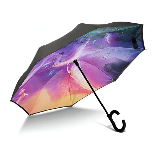 Parapluie inversé avec un motif coloré représentant un paysage abstrait dans des tons de violet, rose et jaune. Manche en forme de C noir., 45501178970367 | Licorne Shop