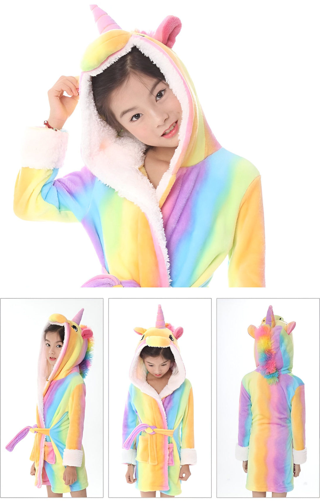 Une jeune fille porte une combinaison pyjama licorne arc-en-ciel avec une capuche et des oreilles de licorne. La combinaison est ouverte sur le devant et nouée à la taille par une ceinture. La capuche est doublée de fourrure blanche. La combinaison est faite d'un tissu doux et pelucheux.