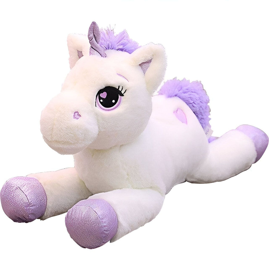 Une peluche licorne blanche et violette allongée.