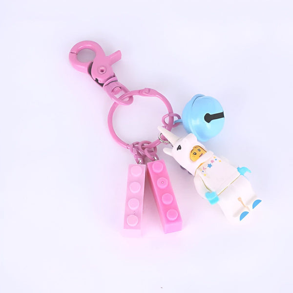 Porte-clés rose avec un mousqueton, des briques de construction roses, une clochette bleue et une figurine LEGO d'un astronaute licorne., 45501256990975 | Licorne Shop