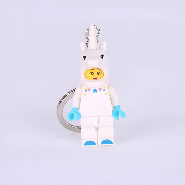 Porte-clés figurine Lego avec une personne portant un costume de licorne blanche, mains et pieds bleus., 45501256892671 | Licorne Shop