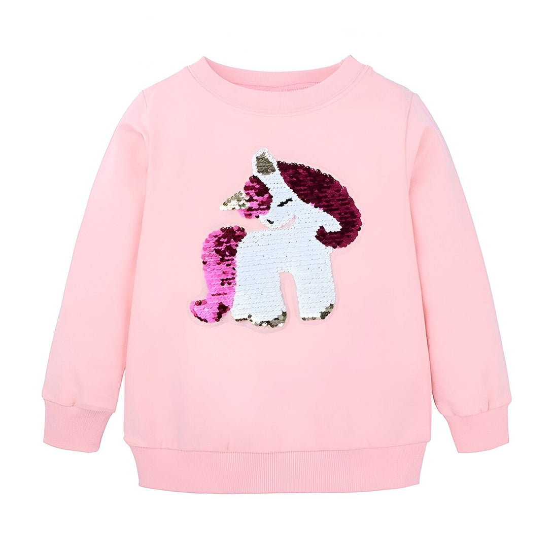 Une image d'un sweat-shirt rose pour enfant avec une licorne à paillettes réversibles.