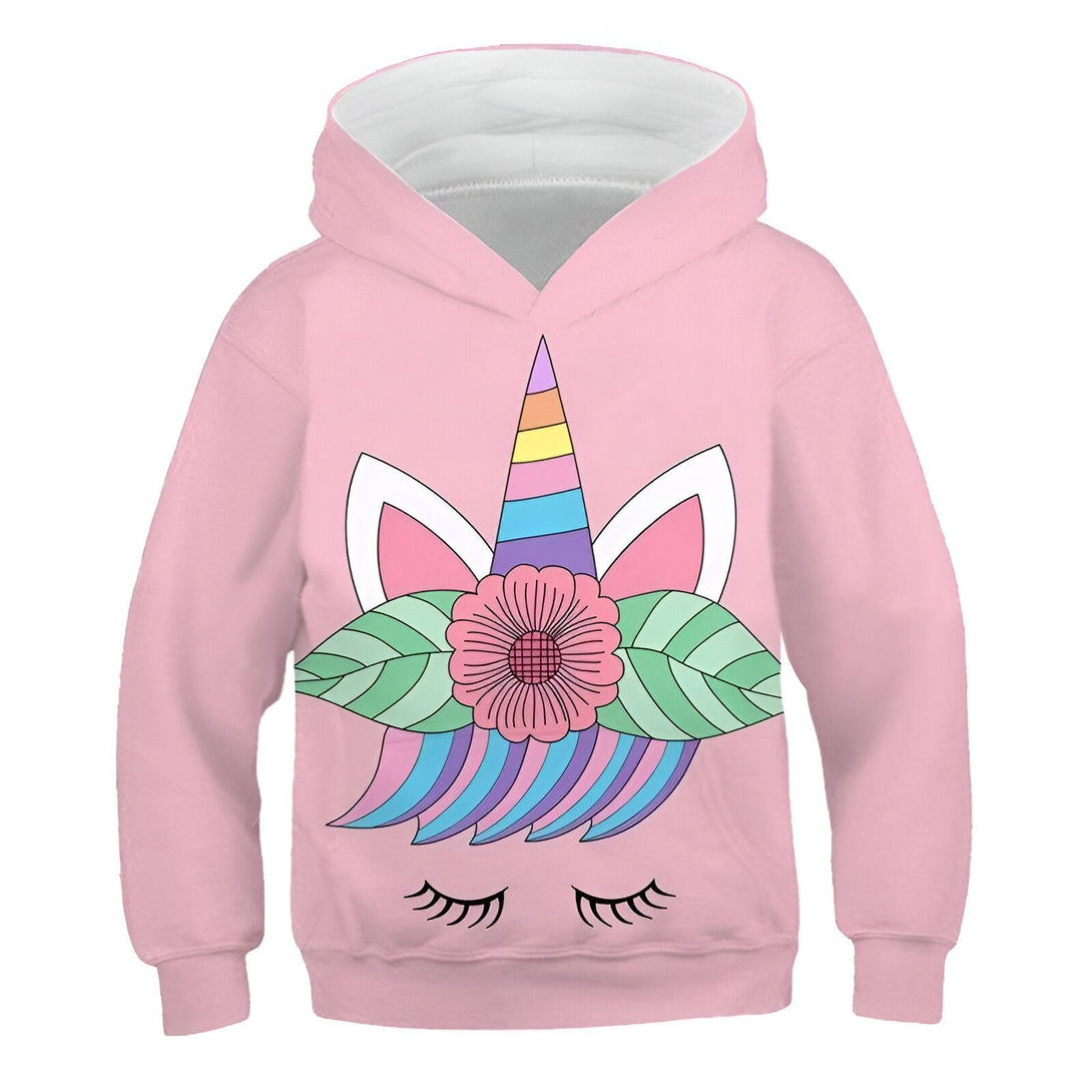 Une illustration d'un sweat à capuche rose avec une capuche doublée de blanc. Sur le devant du sweat, il y a un motif de licorne avec une crinière arc-en-ciel, des oreilles blanches et une corne. La licorne est entourée de fleurs et de feuilles vertes.