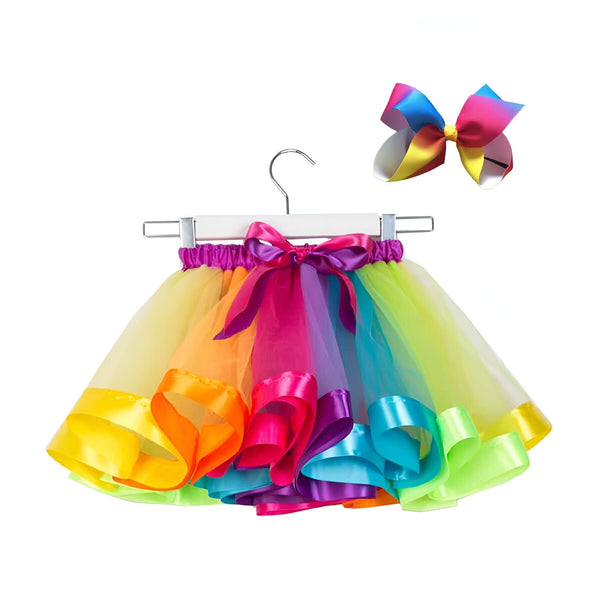 Jupe tutu multicolore pour enfant avec rubans satinés sur un cintre, accompagnée d'un grand nœud assorti. Idéal pour fêtes et déguisements., 45501414932735,45501414965503,45501414998271,45501415031039,45501415063807,45501415096575,45501415129343,45501415162111 | Licorne Shop