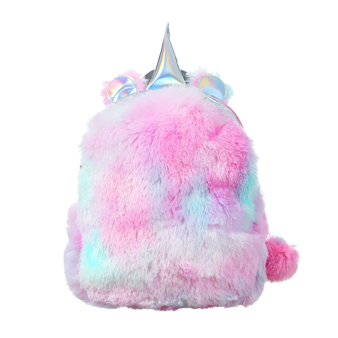 Une peluche licorne rose et bleue avec une corne et une queue arc-en-ciel.