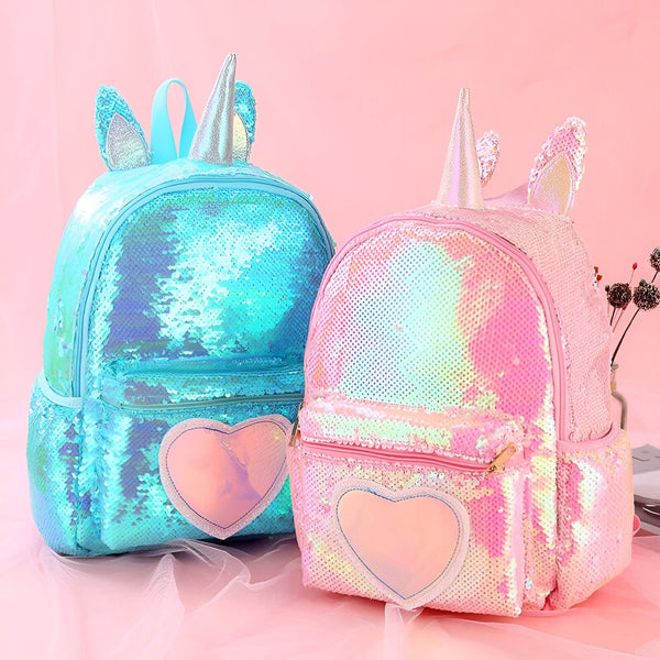 Deux sacs à dos licorne scintillants : un bleu et un rose. Ils ont des oreilles, une corne et une poche en forme de cœur., 45501274456319 | Licorne Shop