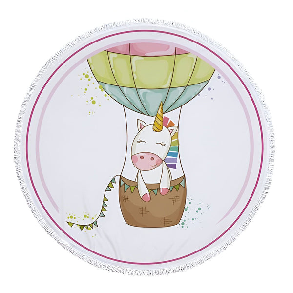Serviette de plage ronde avec un motif d'une licorne dans une montgolfière, fond blanc avec des touches de couleur, bordure à franges blanches., 45501225271551 | Licorne Shop