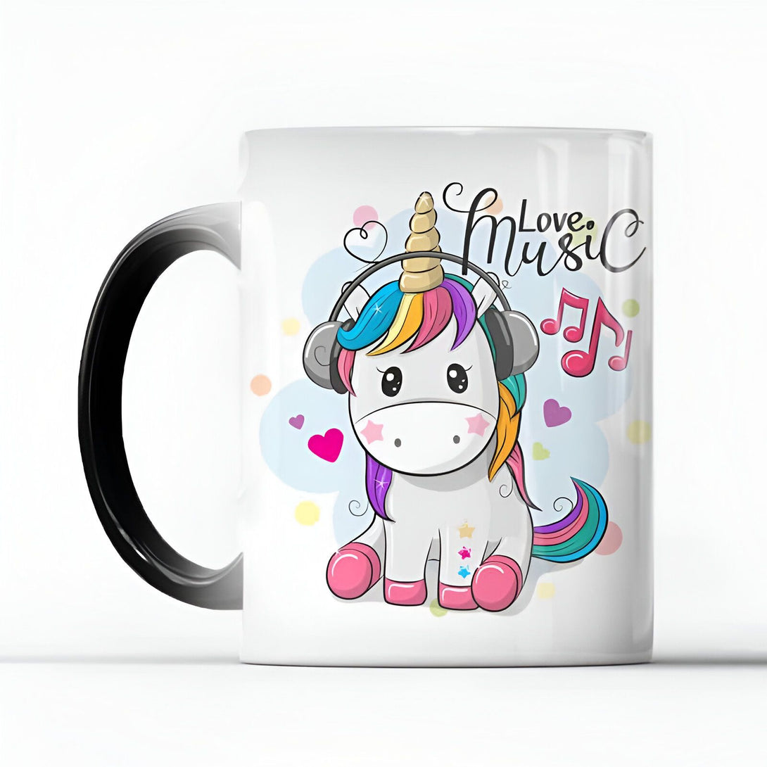 Mug blanc avec anse noire, illustré d'une licorne blanche kawaii portant un casque audio, crinière arc-en-ciel et décorée de notes de musique et de cœurs. Texte "Love Music" en lettrage fantaisie., 45501161046271 | Licorne Shop