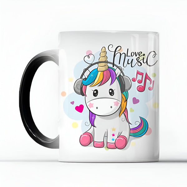 Mug blanc avec anse noire, illustré d'une licorne blanche kawaii portant un casque audio, crinière arc-en-ciel et décorée de notes de musique et de cœurs. Texte "Love Music" en lettrage fantaisie., 45501161046271 | Licorne Shop