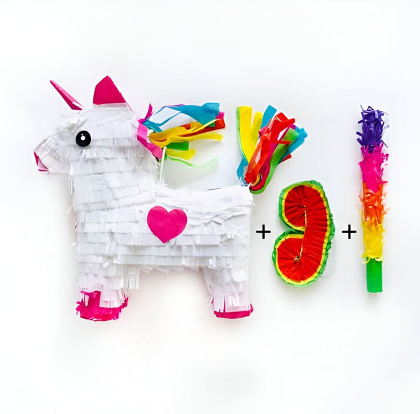 Une piñata licorne blanche avec un cœur rose, des serpentins colorés, une pastèque en papier et un bâton à piñata multicolore. Parfait pour une fête d'anniversaire thématique ou une célébration festive., 45502405411071 | Licorne Shop