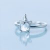 bague-licorne-reglable-en-argent-sterling-avec-opale-bleue-1a.jpg Bague argentée avec un motif de licorne, présentant une petite corne spirale et des oreilles pointues, avec une pierre lumineuse au centre. Bijou fantaisie pour les amoureux des créatures mythiques., 45501845438719,45501845471487,45501845504255,45501845537023,45501845569791,45501845602559,45501845635327,45501845668095,45501845700863,45501845733631,45501845766399,45501845799167,45501845831935,45501845864703,45501845897471 | Licorne Shop