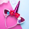 Serre-tête licorne avec des oreilles pailletées, une corne rose brillante et des fleurs colorées. Accessoire de fête fantaisie pour enfant ou adulte. Idéal pour un anniversaire ou un carnaval., 45501375545599 | Licorne Shop