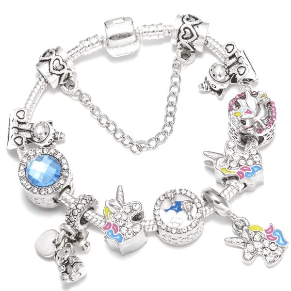 Bracelet de charme argenté avec pendentifs variés : licornes, ours, cœur, pierre bleue. Bijou fantaisie, style Pandora, pour femme ou enfant. Idéal pour un cadeau personnalisé., 45501399531775 | Licorne Shop