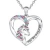 collier-licorne-cristal-argent-1a.jpg Un pendentif en forme de cœur avec une licorne. La licorne est sertie de cristaux roses, bleus et violets. Le cœur est en métal argenté et porte l'inscription "You are magical".