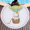 Serviette de plage ronde avec dessin d'une licorne dans une montgolfière, posée près d'une piscine. Une personne est allongée à côté de la serviette., 45501254533375 | Licorne Shop