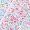 stickers-licornes-varies-pour-personnaliser-1a.jpg Image de feuilles d'autocollants d'licornes mignons avec des couleurs pastel et des motifs variés comme des étoiles, des bonbons, des beignets et des fraises. L'image est lumineuse et joyeuse., 45501134864639 | Licorne Shop